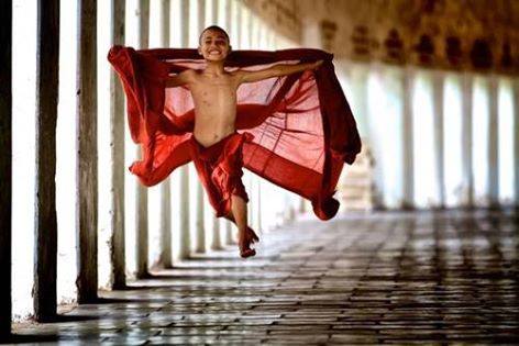 boy monk jumping