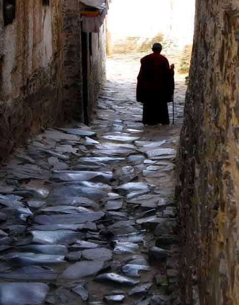 monk on brick road